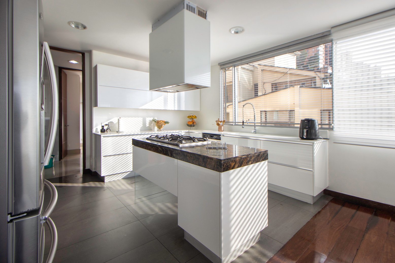 White Kitchen Counter Near White Wooden Kitchen Cabinet